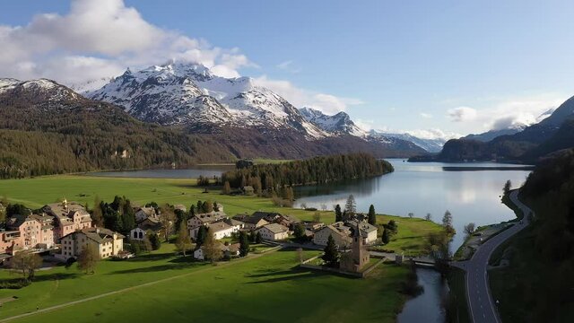 Aerial drone footage of the Sils village and lake in the stunning Engadine valley in the alps in Canton Graubunden (Grisons) in Switzerland