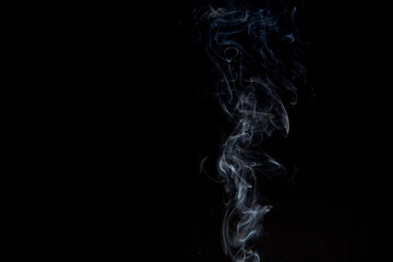 Light smoke on a black background. Cigarette smoke.Background. Place for the text