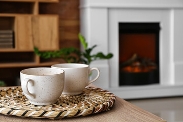 Cups of tea on table in living room, closeup