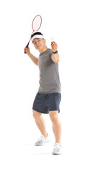 Sporty male badminton player on white background