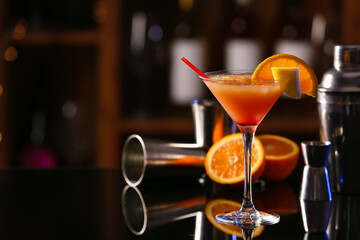 Glass of tasty Sex on the Beach cocktail on table in bar