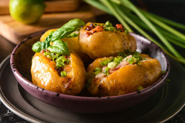 Plate with baked potato on table, closeup