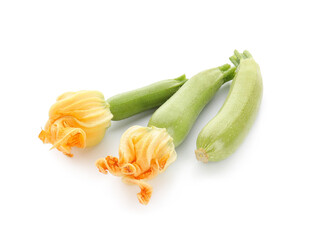 Fresh zucchini with flowers on white background