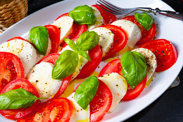 Tomato with mozzarella and basil