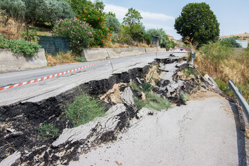 Big pothole on a national road in Sicily caused by landslide, carelessness and abandonment of road...