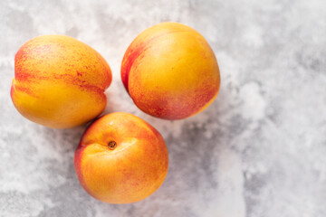 nectarine or peach sweet fruit natural dessert sweets meal snack on the table copy space food background rustic. top view keto or paleo diet veggie vegan or vegetarian food