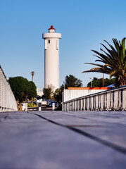 Milnerton Lighthouse as viewed from the new wooden bridge across the Diep River. Woodbridge Island, Cape Town, South Africa.