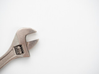 Close up adjustable wrench on white background top view copy space
