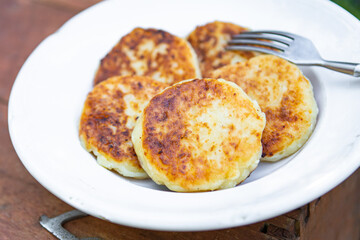 pancake syrniki sweet pancakes cottage cheese breakfast outdoor meal snack on the table copy space food background rustic top view keto or paleo diet