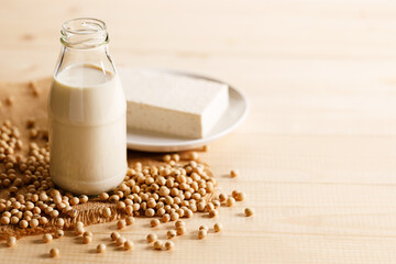 soy milk in a bottle on wooden table