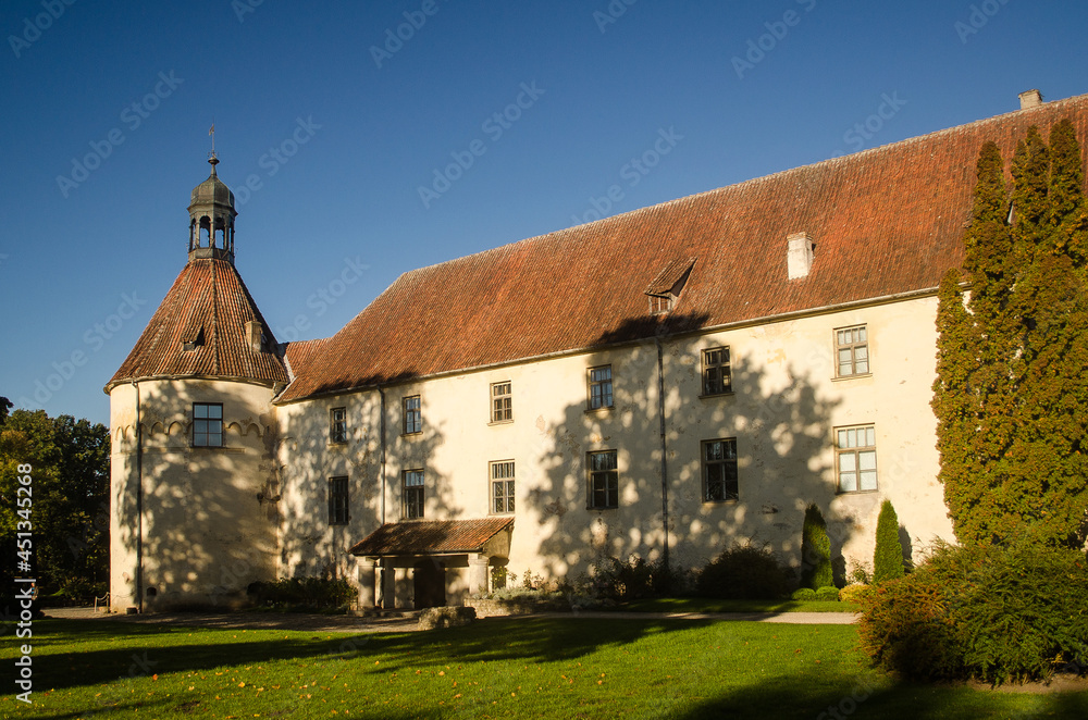 Wall mural Medieval castle with a large tower in Jaunpils, Latvia.