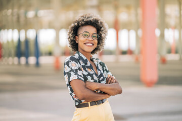 pretty afro woman smiling looks at camera with cool pose