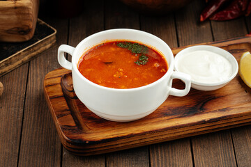 Russian dish solyanka prefabricated meat soup with sour cream