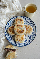 Homemade Chinese pastry snacks. Glutinous Red Bean Sesame Seed Cake. Made from glutinous rice powder wrapped with cooked sweet red bean, sesame seeds and pan fried in low heat non stick pan.