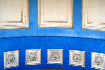 Close-up of white and light blue ornaments at the entrance of St. Peter Cathedral on a beautiful sunny summer morning. Photo taken July 29th, 2021, Geneva, Switzerland.