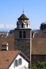 Aerial view of clock tower of church Temple de la Madeleine at the old town of Geneva on a sunny summer day. Photo taken July 29th, 2021, Geneva, Switzerland.