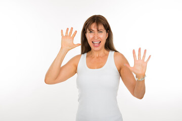 portrait caucasian senior woman with joy expression with hands up on white background