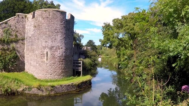 The Bishop's Palace and Gardens, medieval historic castle palace with moat near Wells Cathedral in Somerset UK. Bishops of the Diocese of Bath and Wells. English Heritage as a Grade I listed building