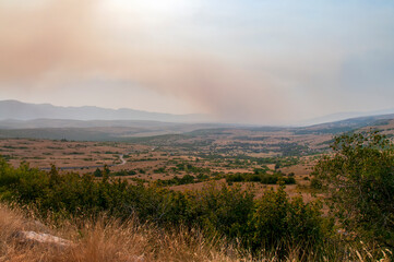 Smoke from a nearby fire hovered over the valley. On one of the trips through Herzegovina, I...