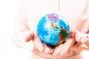 woman holds planet earth in her hand on a white background, isolate