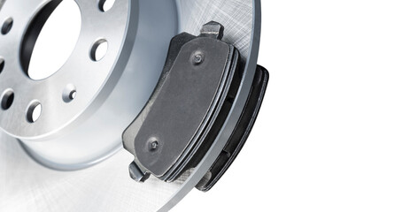 Brake discs and brake pads isolated on white background. Auto parts. Brake disc rotor isolated on white. Braking disk. Car part. Quality spare parts for car service or maintenance. © Aleksei