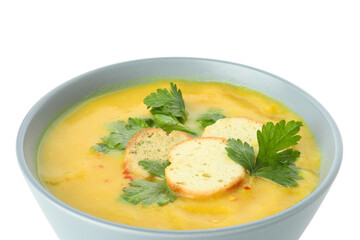 Plate of pumpkin soup isolated on white background
