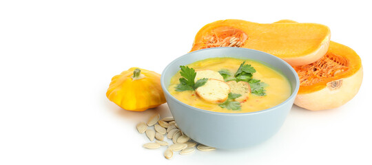 Pumpkin soup and ingredients isolated on white background