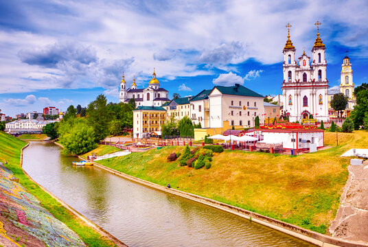 Vitebsk, Belarus - August 1, 2021: City Skyline with Resurrection Church and Town Hall Across The Vitba River in Vitebsk, Belarus, August 1, 2021