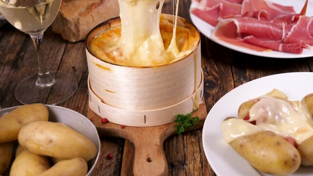 mont d'or- traditional French cheese fondue with ham and potato