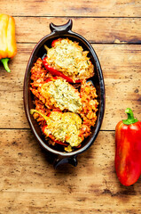 Stuffed peppers with meat on wooden background
