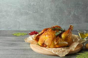 Thanksgiving Day roast turkey on gray textured table
