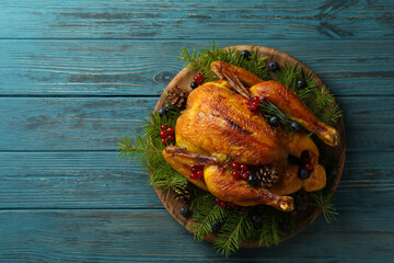 Concept of Christmas roast turkey on wooden table