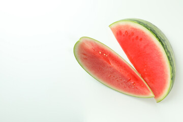 Two juicy watermelon slices on white background