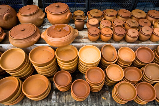 Earthenware kitchen utensils are sold in Georgia.