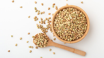 Buckwheat in wood bowl with spoon