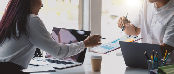 Close up of diverse businesspeople group discussing charts and graphs on meeting, multiethnic team of corporate managers or employees analyzing information materials hardcopy in office together. - obrazy, fototapety, plakaty