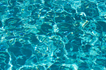 Tansparent clear calm water surface texture. Abstract nature background. Sea water pattern.