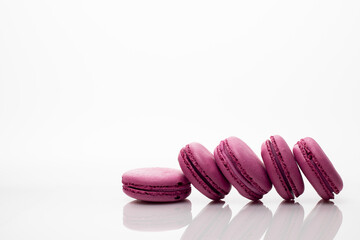 french dessert macaroon on white background with reflexion and copyspace
