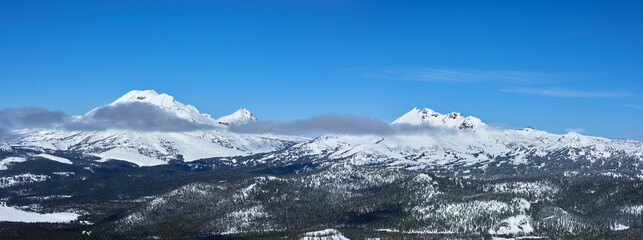 Winter panorama of the snowy Three Sisters mountains in central Oregon.