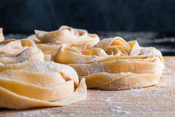 cooking pasta machine work fresh and raw on black background