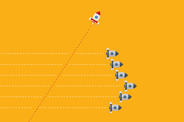 Fototapeta premium Think differently concept. Red rocket changing direction. New idea, change, trend, courage, creative solution, innovation and unique way concept.