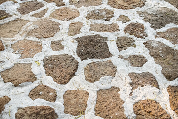 Old walkway texture with seamless patterns white brown background and dried leaf