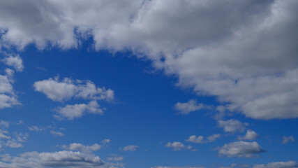 Beautiful blue sky with clouds background. Sky clouds. Air and fluffy clouds in the blue sky on a sunny day, background texture. Copy space. The concept of hope.