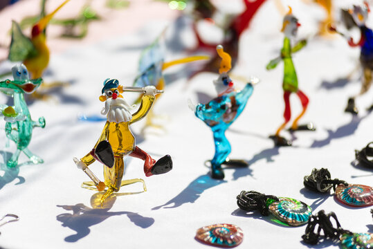 Closeup photo of original colorful miniature figures from glass