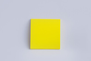 yellow sticky note on white background. Color paper note. Back to school minimal concept