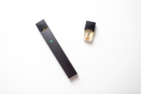 MOSCOW - 26 June 2020: Juul e-cigarette nicotine vapor stick and pods.