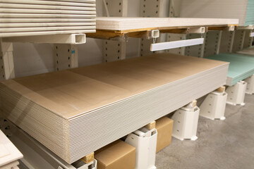 Pallet with Drywall sheets plasterboard in the building warehouse store