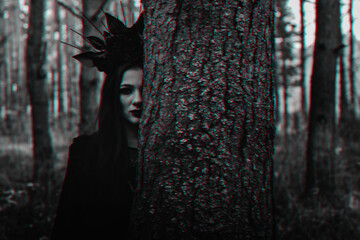 dark portrait of a witch girl in a black costume