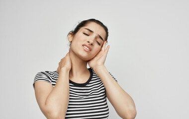 Fototapeta premium woman in striped t-shirt headache health problems stress