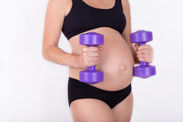 Fototapeta na wymiar Close up Pregnant woman exercising with dumbbells , isolated on white background